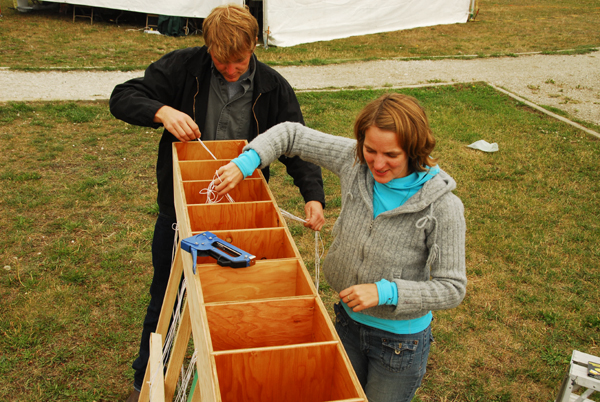 setting up strings_MED_sm on-site dealing with 77 strings as part of setting up To Your Health (photo Michael Edwards)