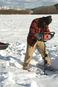 Stankievech boring through the Yukon River ice (photo www.stankievech.net/projects/DEW/pixels/construct13.html)